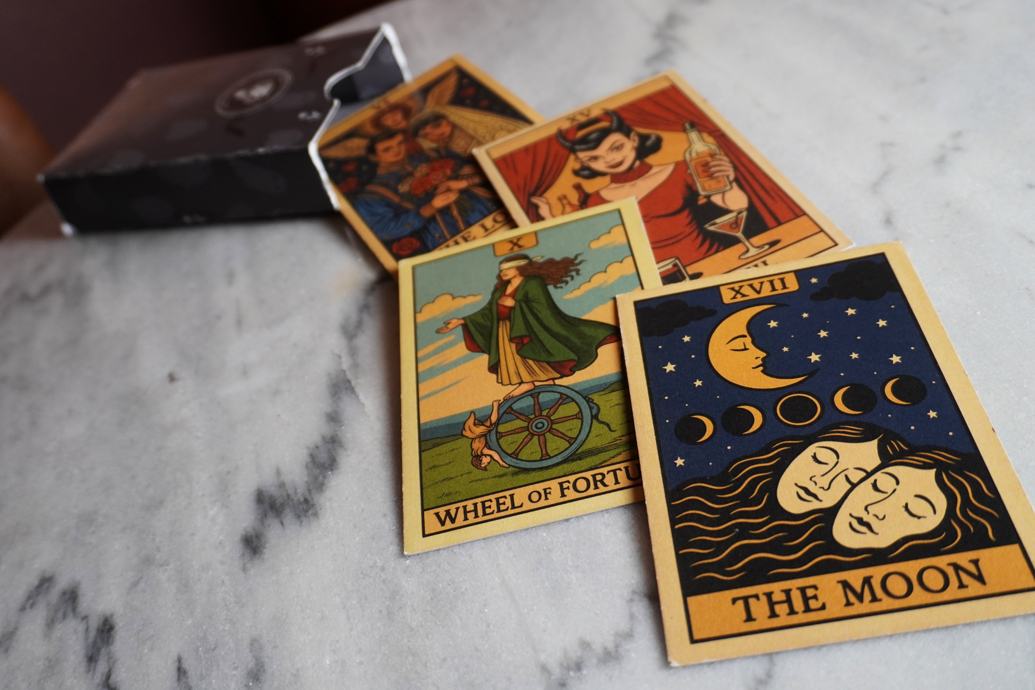 Angled view of the tarot-inspired cocktail menu cards